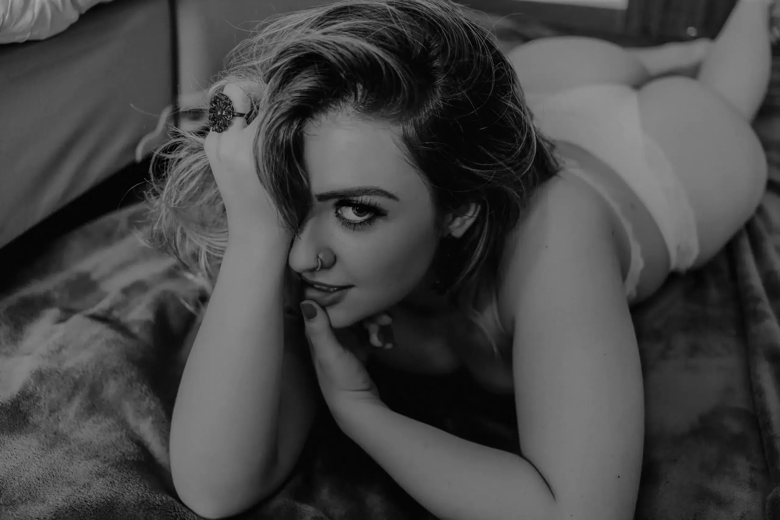 blonde escort in bed